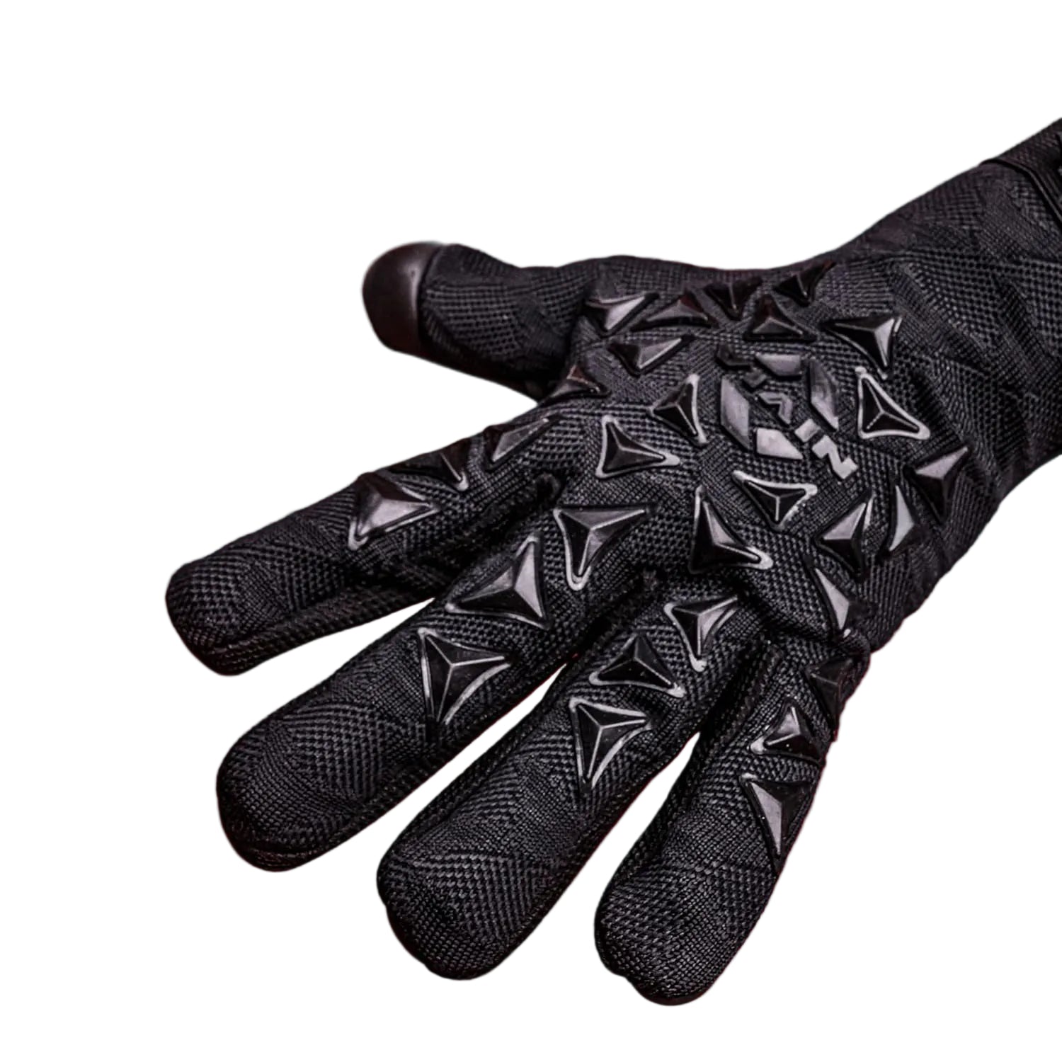 A black protective glove with textured knitted fabric and molded triangular spikes on the back of the hand, shown against a solid red background with promotional text at the top.