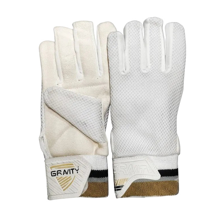 A pair of white cricket gloves with a mesh back and a branded wrist cuff reading 'GRAVITY', shown next to their clear plastic packaging on a white background.