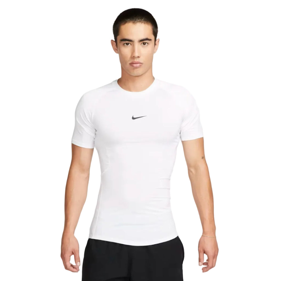 Man wearing a white Nike t-shirt on a plain background