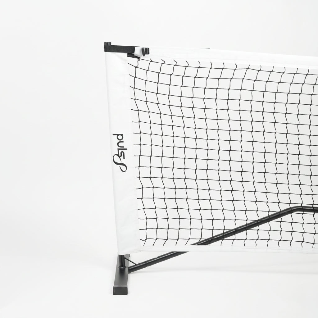 Portable Pickleball  net with stand on a white background