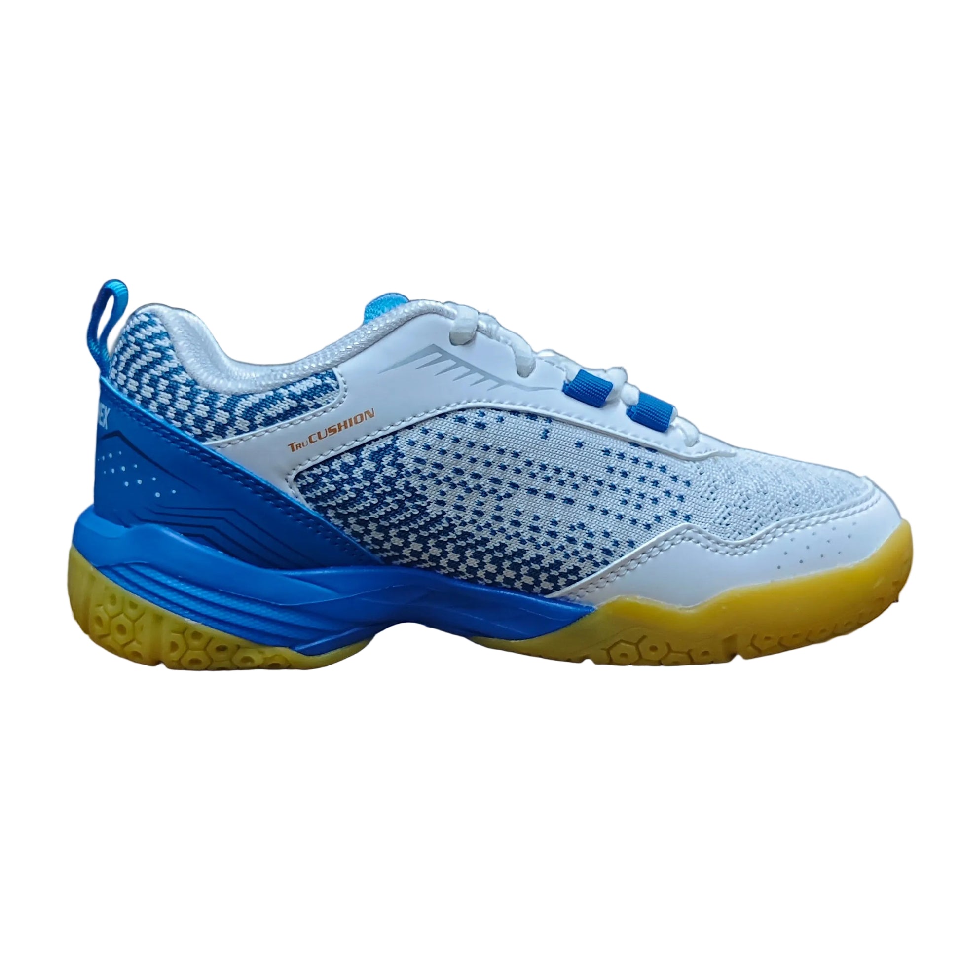 Blue and white sneaker with yellow sole on a cardboard box in a warehouse setting